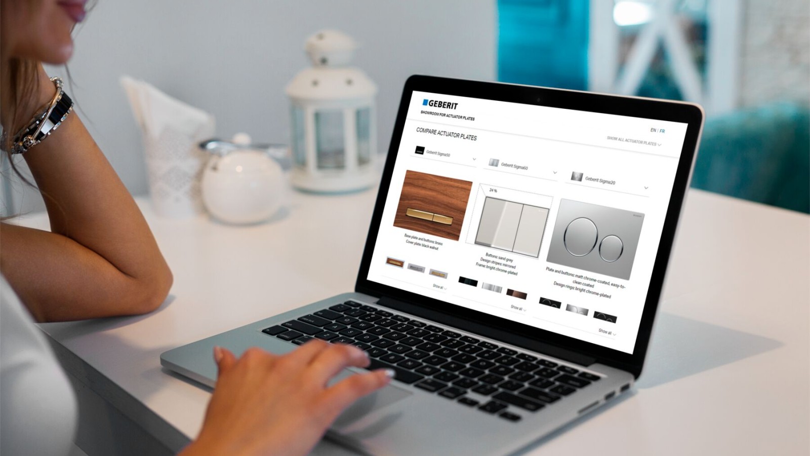 Woman compares actuator plates from Geberit